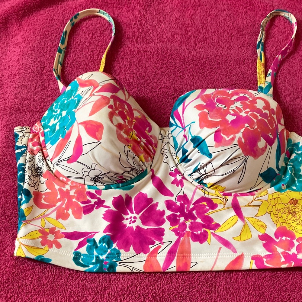Bikini top that comes down below bustline. Adjustable straps with underwire